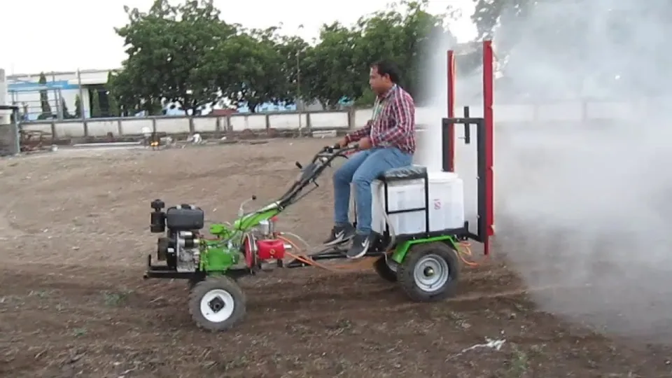 ALAP boom sprayer attachment mounted on a power weeder spraying a field